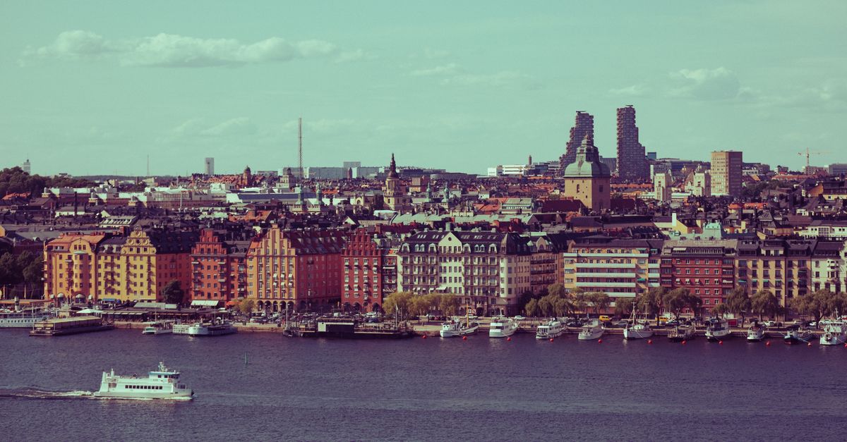 Vibrant cityscape of Stockholm, featuring historic and modern architecture by the water.